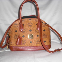 MCM MINI MUNCHEN MONOGRAM CROSS BODY.